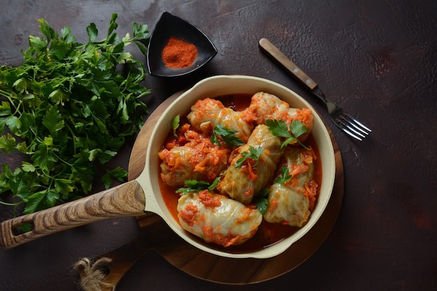 Cabbage rolls stuffed with ground beef and rice in tomato sauce