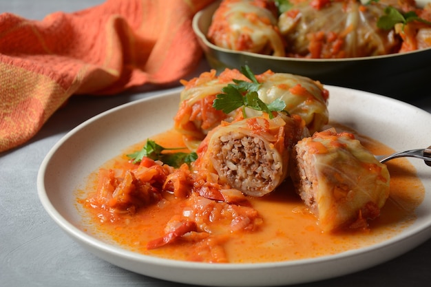 Cabbage rolls stuffed with ground beef and rice in tomato sauce