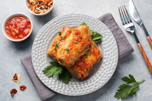 Cabbage rolls with beef, rice and vegetables on the plate. Stuffed cabbage leaves with meat.