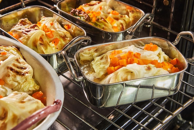 Cabbage rolls with salmon carrots and sauce are baked in the oven French recipe