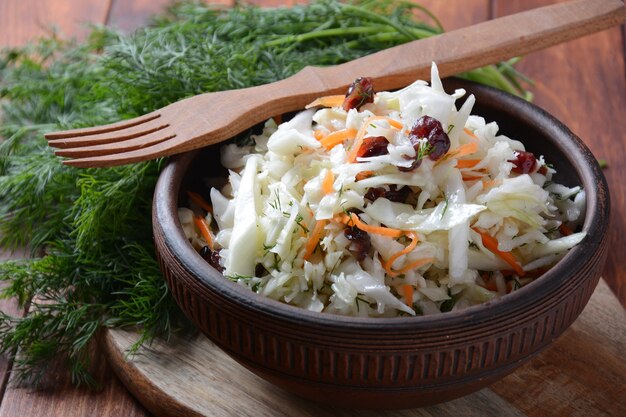 Cabbage  salad with carrot, smoked almonds and dried cranberries