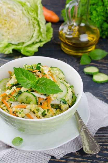 Cabbage salad with cucumber in a bowl