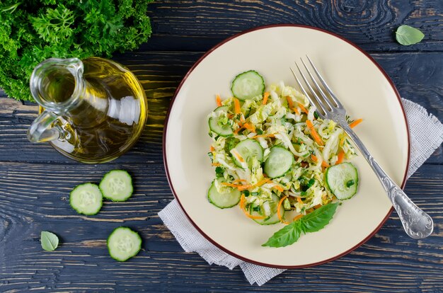 Cabbage salad with cucumber in a bowl