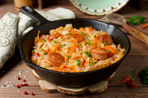 Cabbage stew with grilled sausage