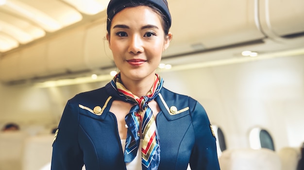 Cabin crew or air hostess working in airplane