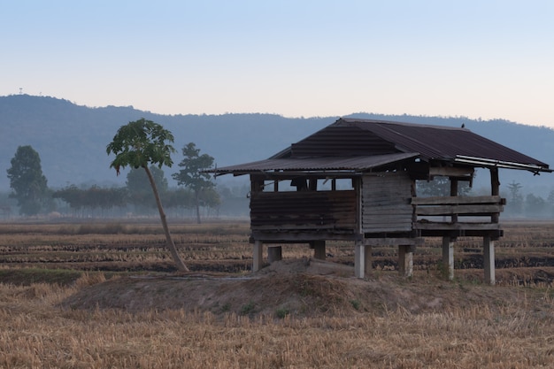 Cabin for farmers with a mountain backdrop