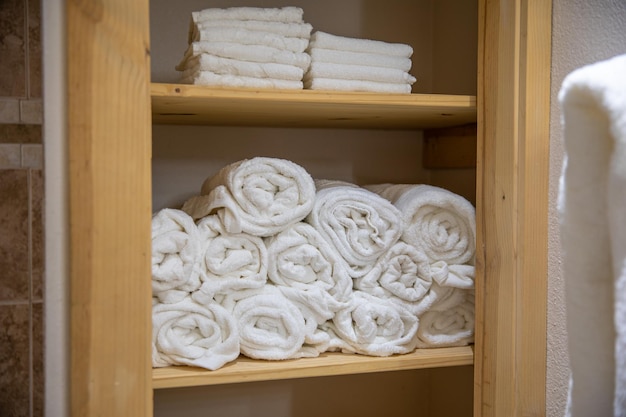 A cabinet full of clean white towels