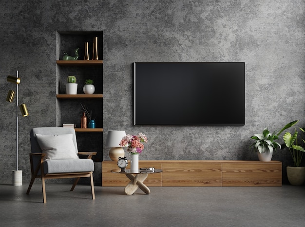 Cabinet TV in modern living room with armchair,lamp,table,flower and plant on concrete wall