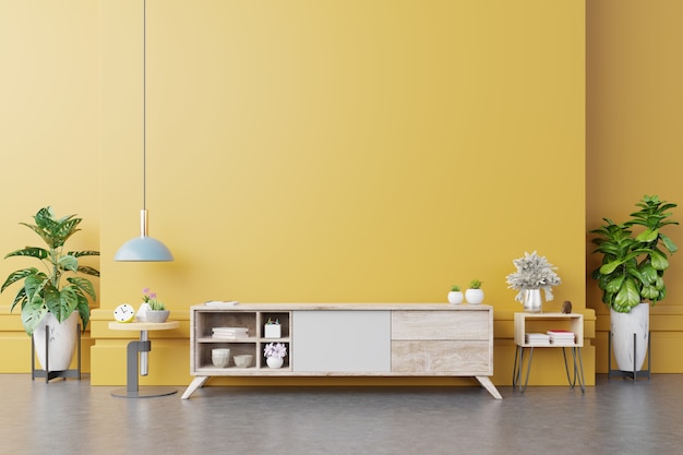 cabinet tv in modern living room with lamp, table, flower and plant on yellow wall. 3d rendering