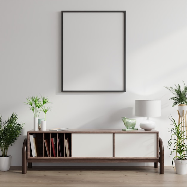 Photo cabinet with plants and blank poster on white wall