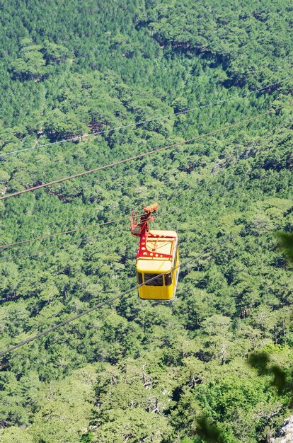 Cable car high above the forest. Russia, Republic of Crimea. 06.13.2018. Cable car Mishor - Ai-Petri