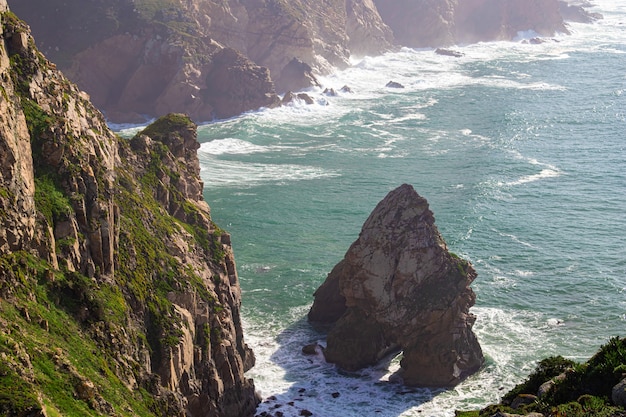 Cabo da Roca. Cliffs, rocks, waves and clouds on the Atlantic ocean coast in Sintra, Portugal