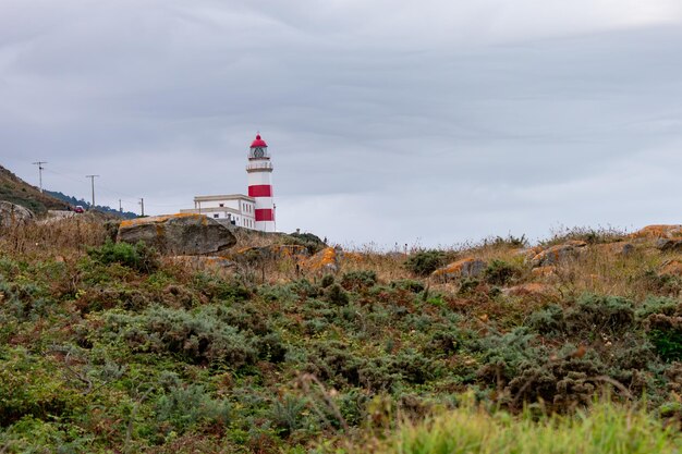 Photo the cabo silleiro lighthouse dominating the entire ocean