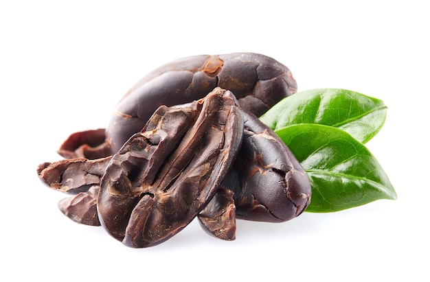 Cacao beans with leaves on white