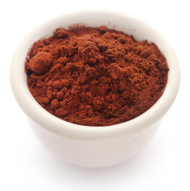 Cacao Powder in a bowl over white background
