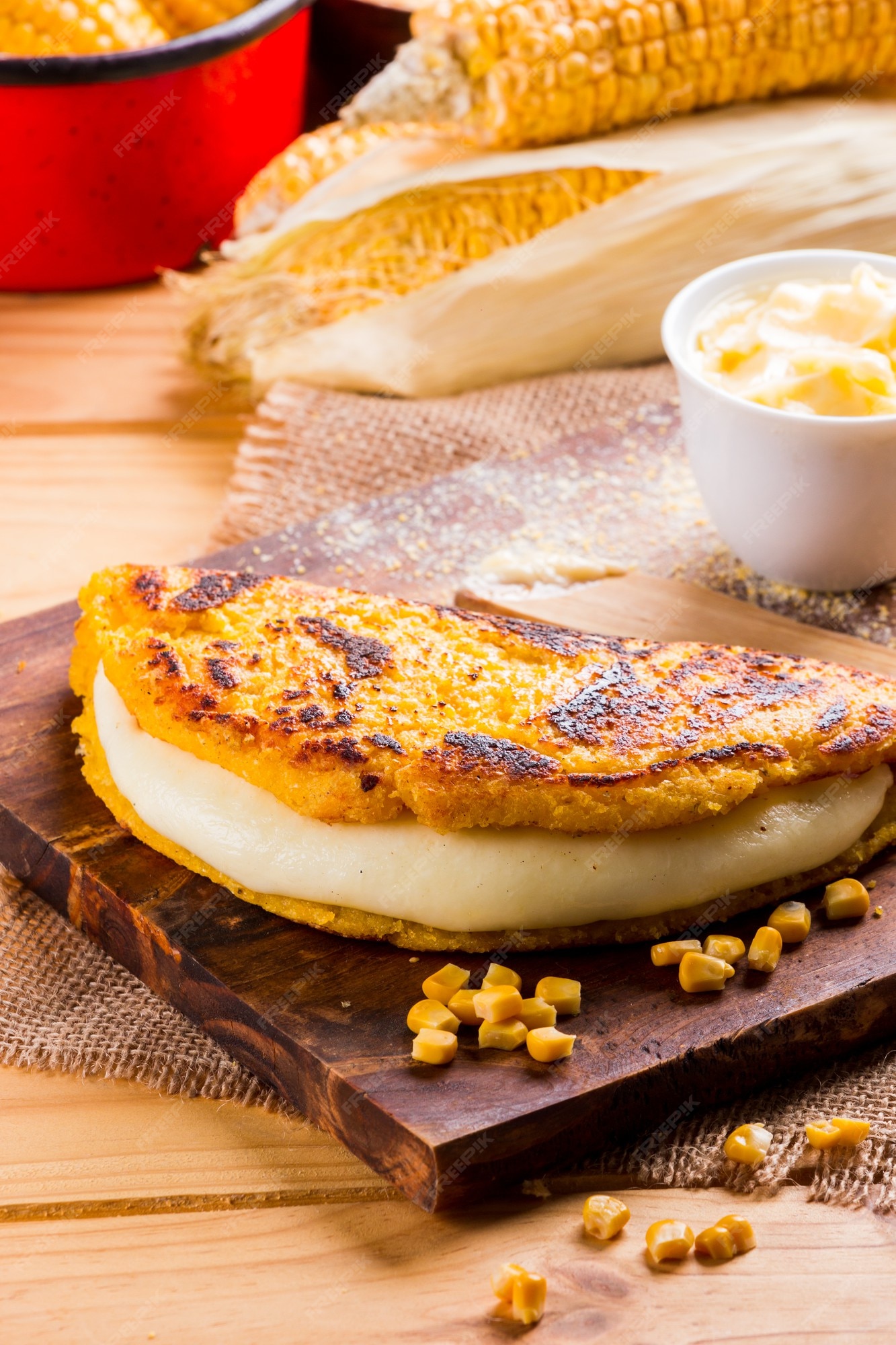 Premium Photo | Cachapas with cheese corn butter ground corn and white  cheese venezuelan cuisine