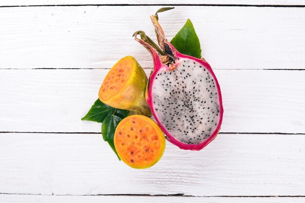 Cactus fruit and dragon fruit Fresh Tropical Fruits On a wooden background Top view Copy space