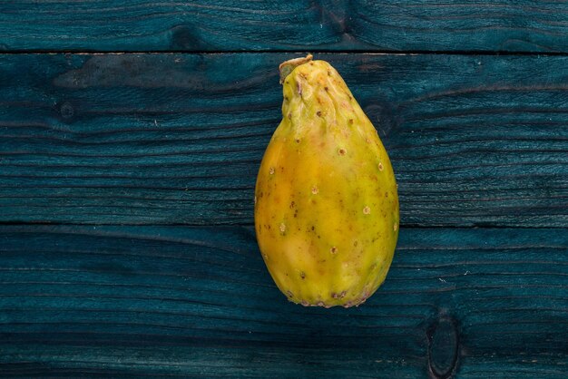 Cactus fruit tropical fruits on a wooden background top view copy space