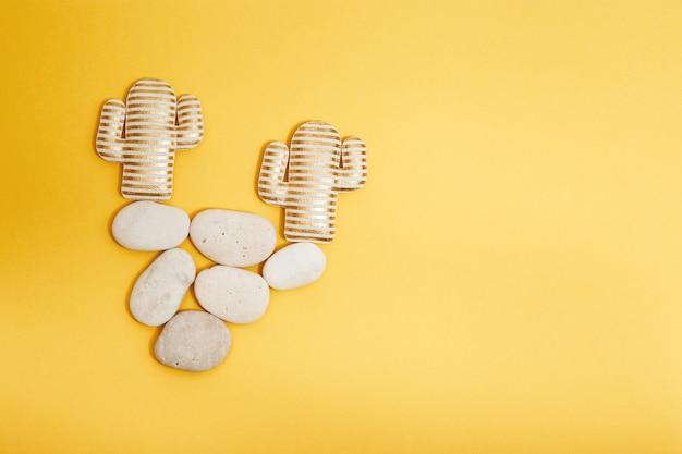 Cactus toys on stone, balance or counterweight