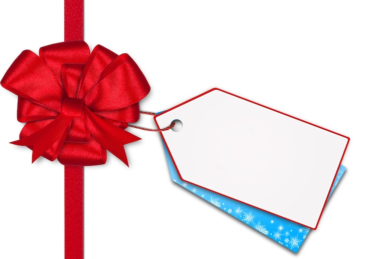 Foto cadeaubon notitie met lint op geïsoleerde achtergrond