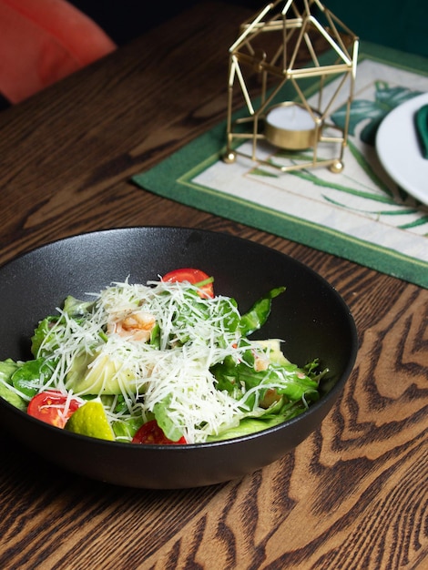 Caesar salad in a black bowl