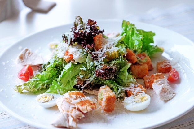 Caesar salad on table in cafe