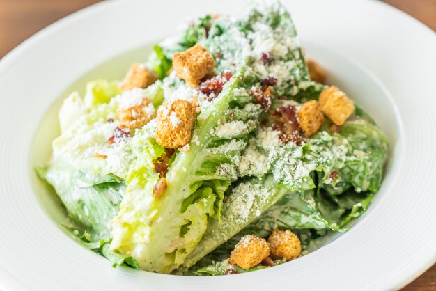 Caesar salad on white plate