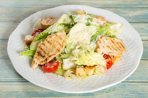 Caesar salad with chicken and parmesan cheese