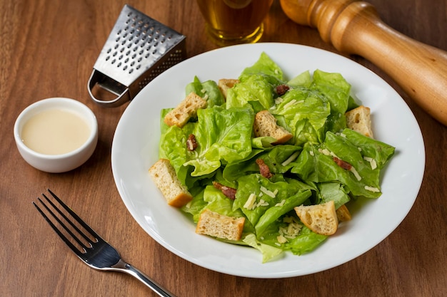 Caesar salad with croutons and bacon.