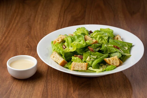 Caesar salad with croutons and bacon.