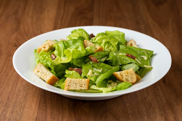 Caesar salad with croutons and bacon.