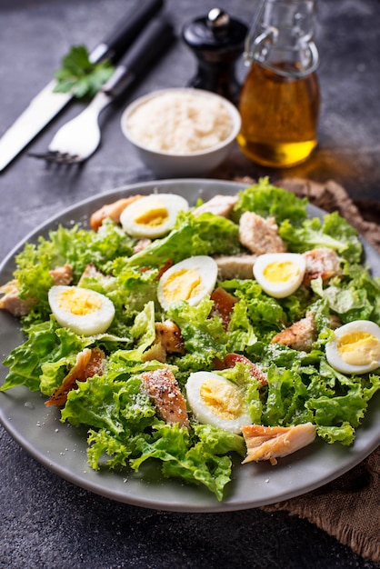 Caesar salad with eggs, chicken and parmesan