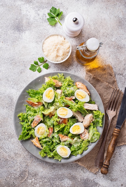 Caesar salad with eggs, chicken and parmesan