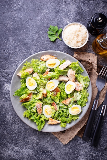 Caesar salad with eggs, chicken and parmesan