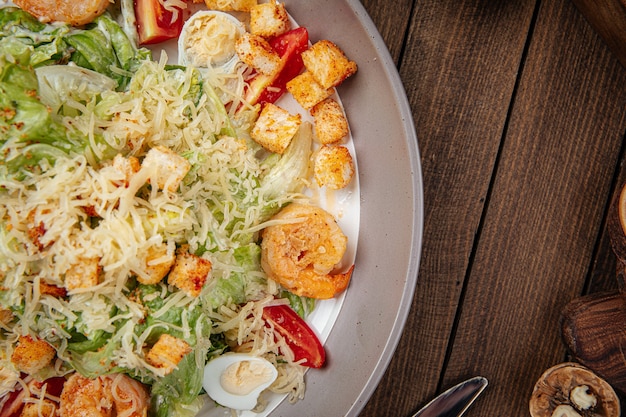 Caesar salad with shrimp and croutons