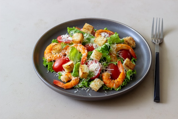 Photo caesar salad with shrimps. healthy eating. diet. recipes.