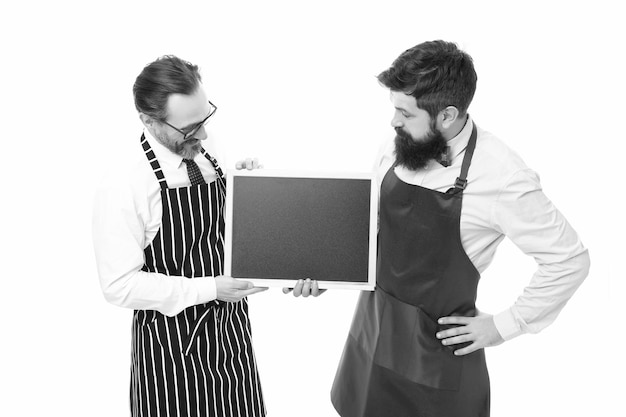 Cafe and restaurant opening catering business welcome on board partners start up menu planning happy chef team in apron bearded men with blackboard copy space restaurant opening advertisement