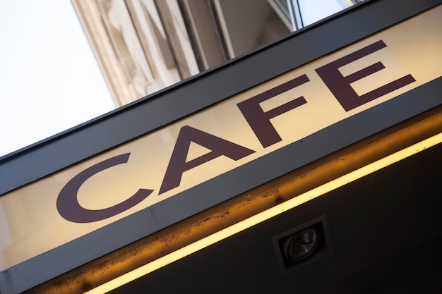 Cafe Sign on Building Facade