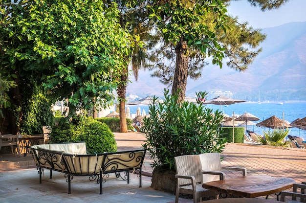 Cafe tables under green trees Marmaris Turkey