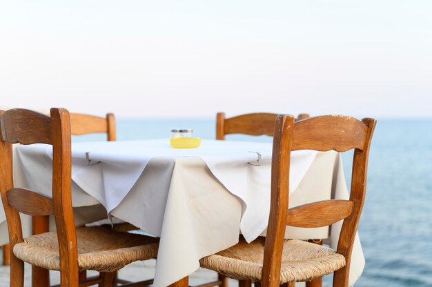 Cafe tables on the sea mediterranean embankment