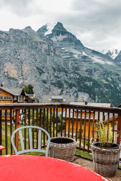 Cafe terrace with table and chair Jungfrau mountain view in Swiss Alps village in Switzerland