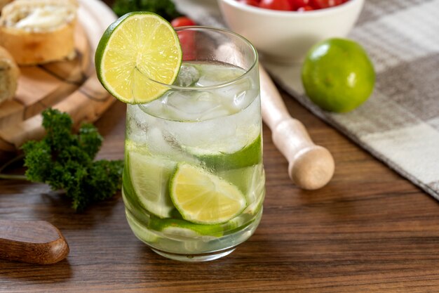 Caipirinha, typical Brazilian cocktail made with lemon (selective focus; close-up shot).