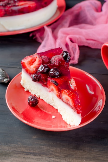 Cake or cheesecake with berries and a cup of coffee