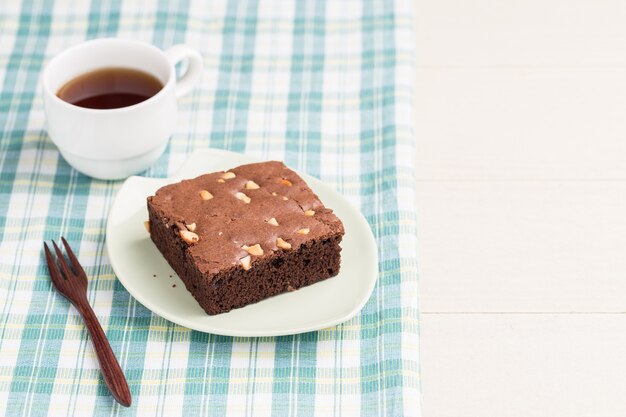 Cake chocolate brownies on white wooden background