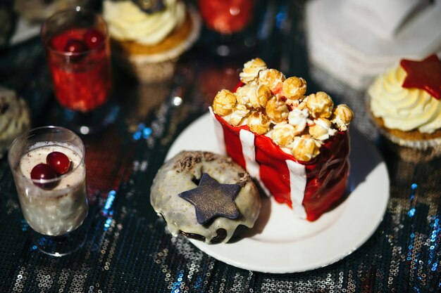 Cake and chocolate frosting decorated the top with popcorn Closeup