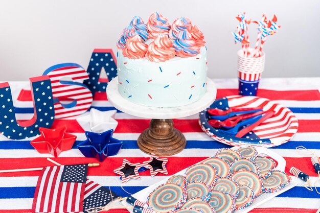 Cake, cookies, and fruit and vegetable snack tray at the July 4th celebration party.