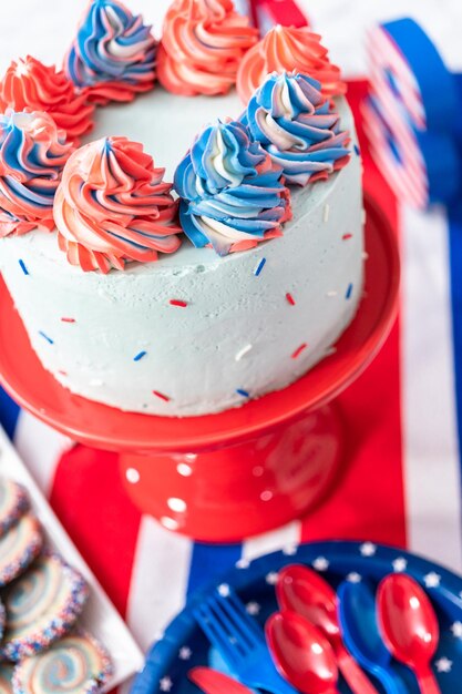 Cake, cookies, and fruit and vegetable snack tray at the July 4th celebration party.