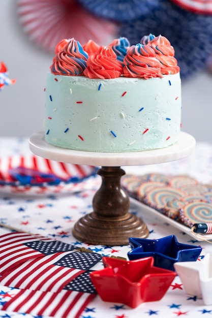 Cake, cookies, and fruit and vegetable snack tray at the July 4th celebration party.