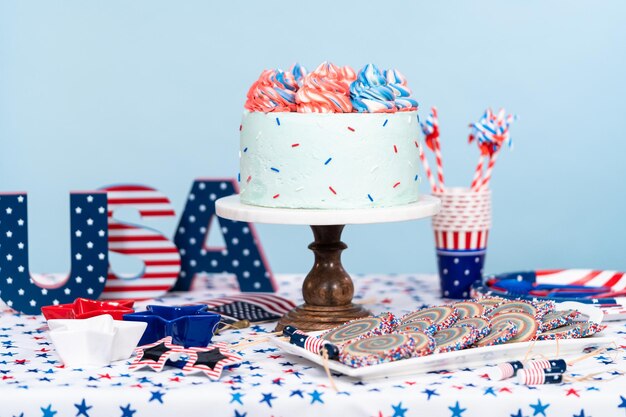 Cake, cookies, and fruit and vegetable snack tray at the July 4th celebration party.