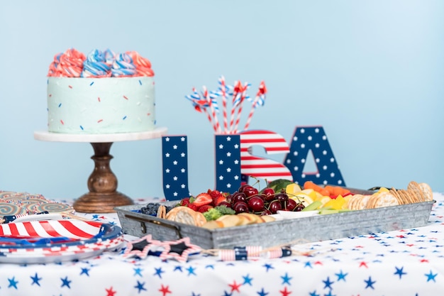 Cake, cookies, and fruit and vegetable snack tray at the July 4th celebration party.